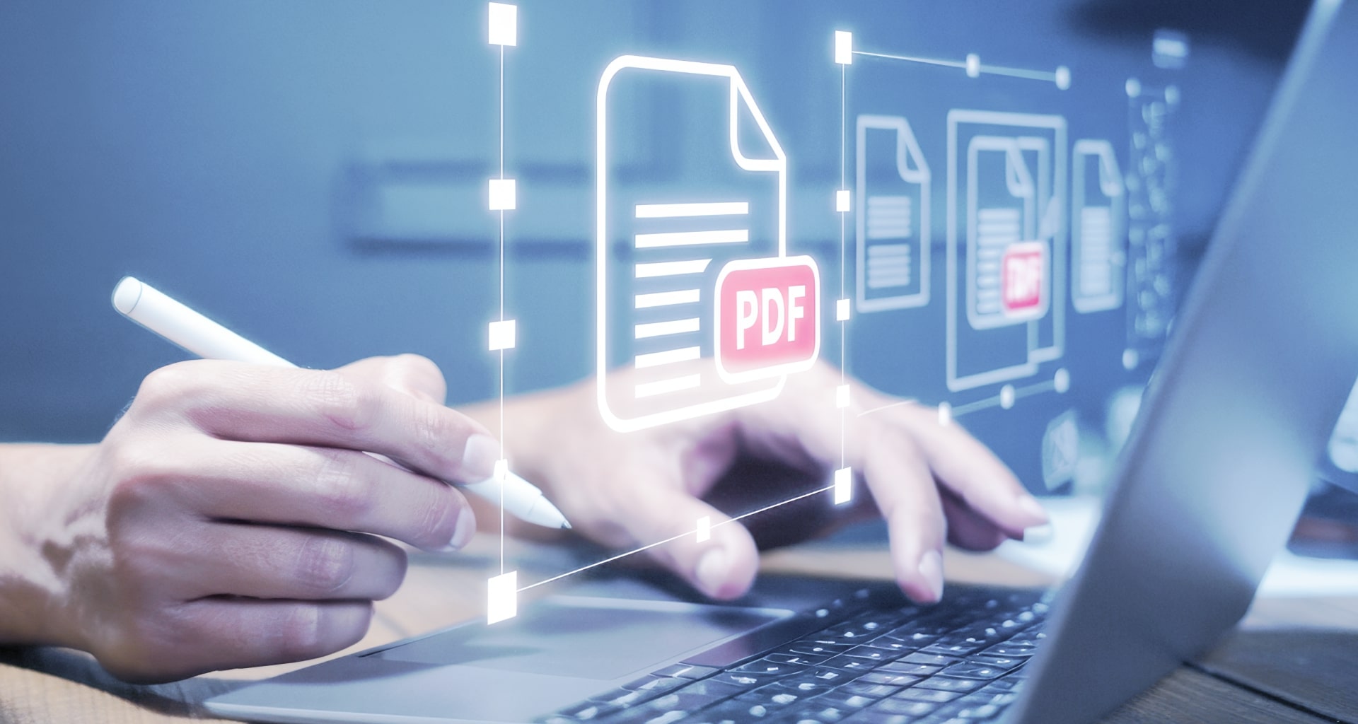 Hand editing a PDF on a laptop, symbolizing digital document workflows.